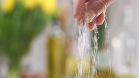 A chef's hand sprinkles salt. Stock Footage 151045544