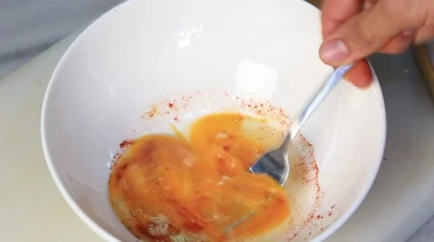 Chefs hand whisk beating broken eggs on bowl close-up video. Stock Footage 54924751