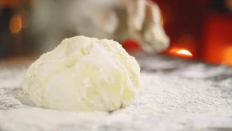 Chef's hand working with de dough Stock Footage 100635587