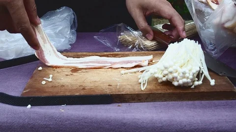 The chef`s hands are cutting bacon for evening party. Stock Footage 116077075