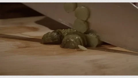 Chef's hands are cutting pickled cucumbers with a professional knife for salad 動画素材 221246519