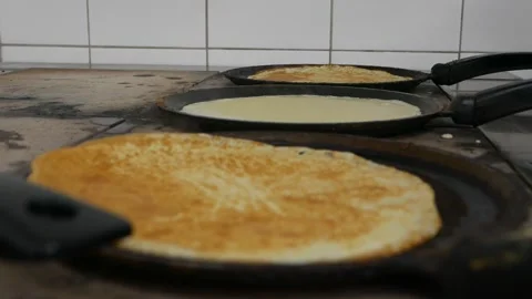 Chef's hands are preparing pancakes Stock Footage 148459022
