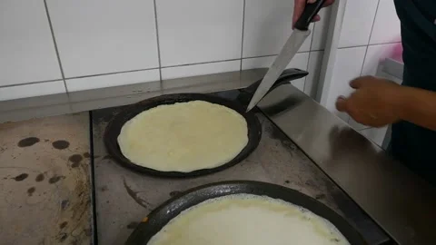 Chef's hands are preparing pancakes Stock Footage 148460205