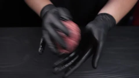 The chef's hands in black gloves form a hamburger patty. Stock Footage 222615879