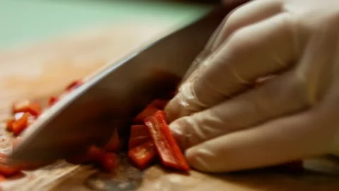 Chef's hands chopping fresh sweet red bell pepper. Process of making quesadillas Stock Footage 151175488