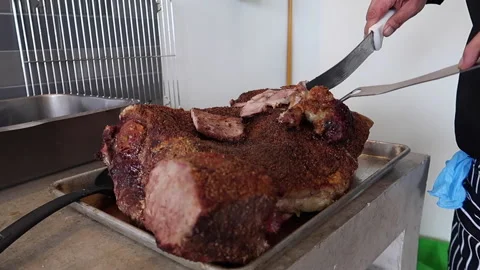 Chef's hands cut roast beef Stock Footage 208964844
