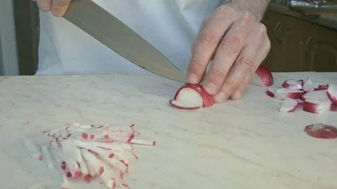 Chefs hands cutting a fresh radish. Stock Footage 80073625