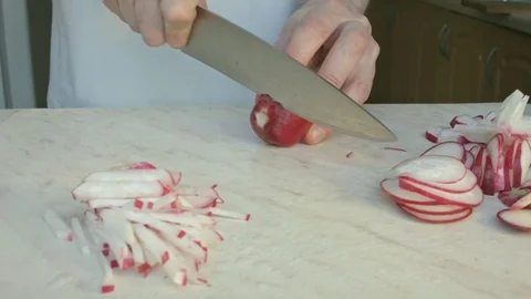 Chefs hands cutting a fresh radish. Stock Footage 80074353