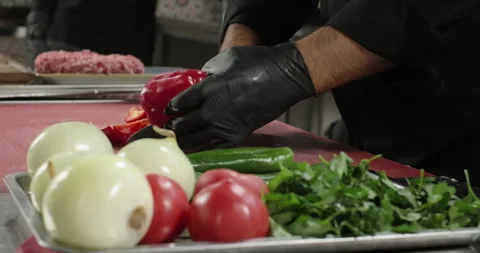 Chef's hands cutting fresh red bell pepper with knife. Healthy lifestyle food Stock Footage 258558285