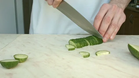 Chefs hands cutting a green fresh cucumber. Stock-Footage 80441712