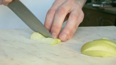 Chefs hands cutting a green fresh apple. 스톡 동영상 80460051