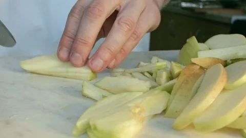Chefs hands cutting a green fresh apple. Stock Footage 80462891