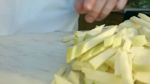Chefs hands cutting a green fresh apple. Video stock 80464479