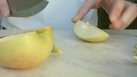 Chefs hands cutting a green fresh apple. Video stock 80469531