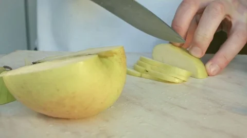 Chefs hands cutting a green fresh apple. 스톡 동영상 80471509