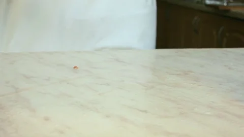 Chefs hands cutting a red fresh tomato. Video stock 80441599