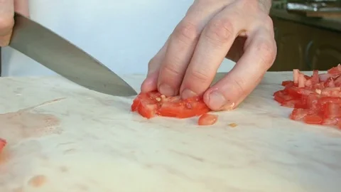 Chefs hands cutting a red fresh tomato. 스톡 동영상 80460092