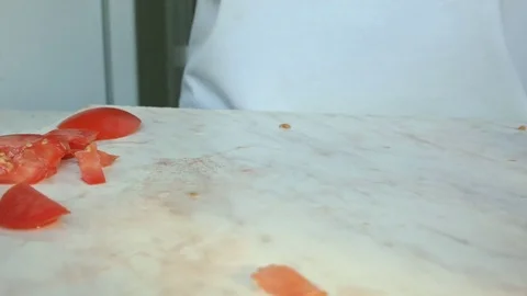 Chefs hands cutting a red fresh tomato. 스톡 동영상 80460097