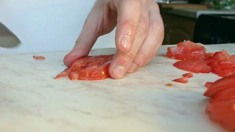 Chefs hands cutting a red fresh tomato. 스톡 동영상 80460105