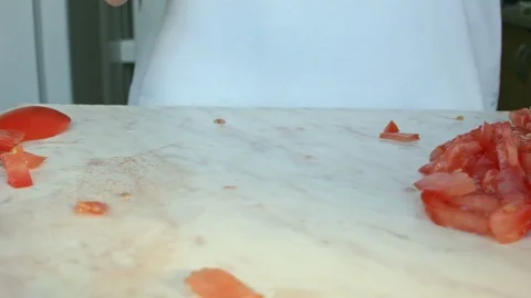 Chefs hands cutting a red fresh tomato. 스톡 동영상 80460108