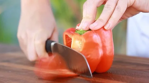 Chef's hands cutting red sweet pepper vegetarian vegetables vegan salad Video stock 73652124