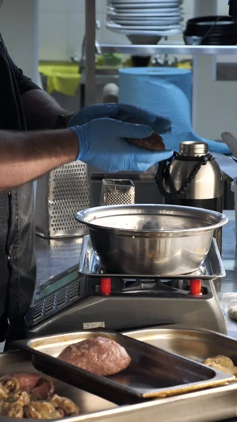 A chef's hands form a patty from ground meat. Stock Footage 334336531