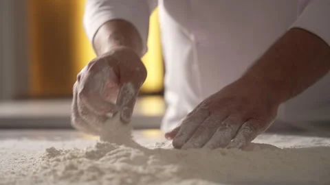 Chef's hands kneading and preparing raw dough for baking Stock Footage 333577783