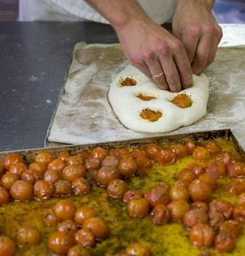 Chefs Hands Kneading Fresh Bread Dough on a Floured Worktop Stock Photos