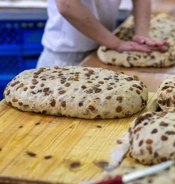Chefs Hands Kneading Fresh Bread Dough on a Floured Worktop Stock Photos