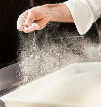 Chefs Hands Kneading Fresh Bread Dough on a Floured Worktop Stock Photos