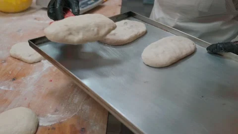 The chef's hands make a cake and put in the oven for baking Stock Footage 148495420