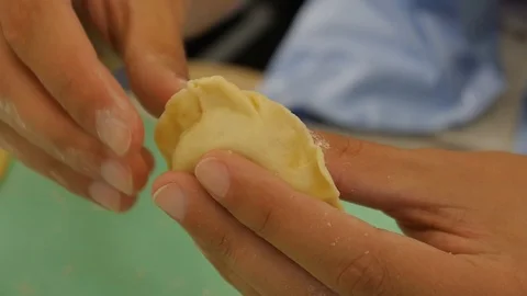 Chef's hands make delicious dumplings Vídeo Stock 122096609