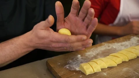 Chef's hands make dumplings from dough 스톡 동영상 123651012