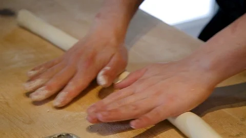 Chefs hands making fresh gnocchi pasta in a restaurant kitchen. Stock Footage 96475260