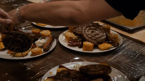 Chefs hands prepare dishes from different sausages close-up Stock Footage 110904403