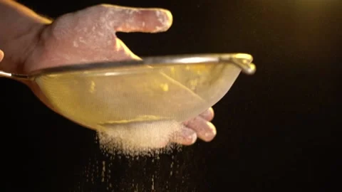 The Chef's Hands Sift the Flour Through a Sieve. Stockbeeldmateriaal 155531517