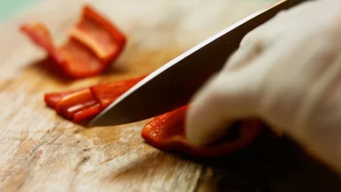 Chef's hands slicing fresh sweet red bell pepper. Process of making quesadillas Stock Footage 151175414