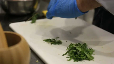 Chef's hands slicing greenery close up view. Stock Footage 144460521