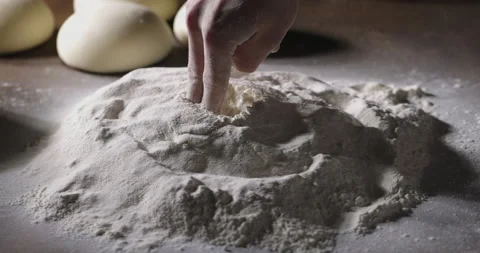 Chef's hands touching flour on table. Bakery worker is checking ingredients Video stock 154874277