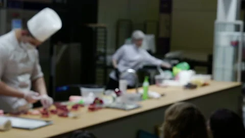 The chefs hold a master class for the audience. Stock Footage 151240242