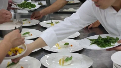 Chefs kitchen plating food gourmet restaurant Stock Footage