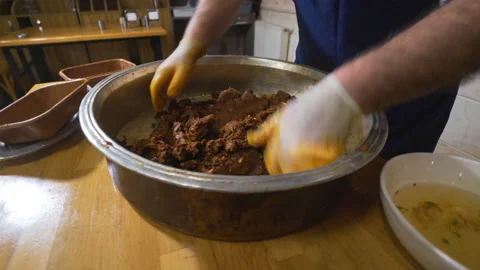 A chef's making Turkish traditional raw meatballs Video stock 147377475