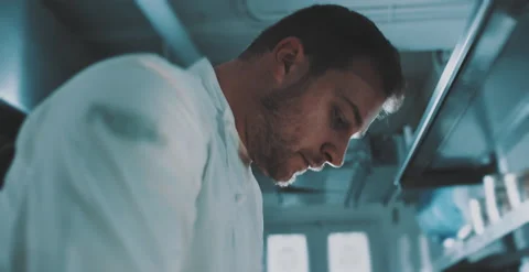 Chefs pays close attention in preparing dish Stock Footage 204972711