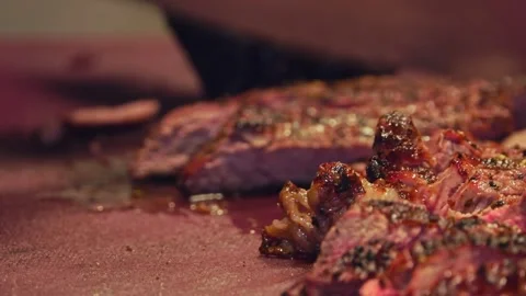 Chef's Precision: Slicing Grilled Beef for Delivery Containers – Close-Up Stock Footage 288690447
