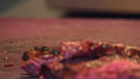 Chef's Precision: Slicing Grilled Beef for Delivery Containers – Close-Up Stock Footage 288690477