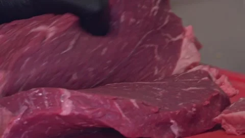 Chef's Precision: Slicing Grilled Beef for Delivery Containers – Close-Up Stock Footage 288690599