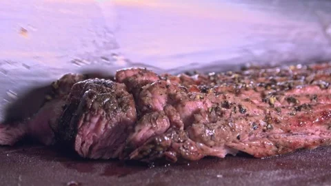 Chef's Precision: Slicing Grilled Beef for Delivery Containers – Close-Up Stock Footage 288690709