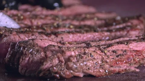 Chef's Precision: Slicing Grilled Beef for Delivery Containers – Close-Up Stock Footage 288690748