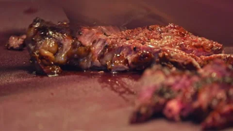 Chef's Precision: Slicing Grilled Beef for Delivery Containers – Close-Up Stock Footage 288693773