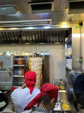 Chefs prepare Arabic shawarma in the kitchen Stock Photos